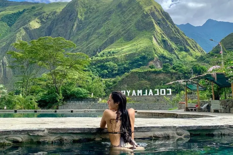 Travelers enjoying Cocalmayo Hot Springs on the Salkantay Trek 4 Days in Peru