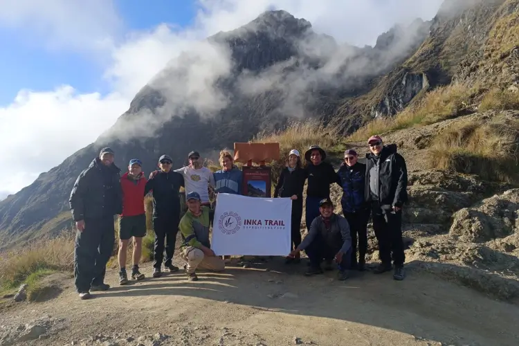 Trekkers crossing Dead Woman Pass surrounded by high Andean peaks during the Salkantay Trek 7 Days
