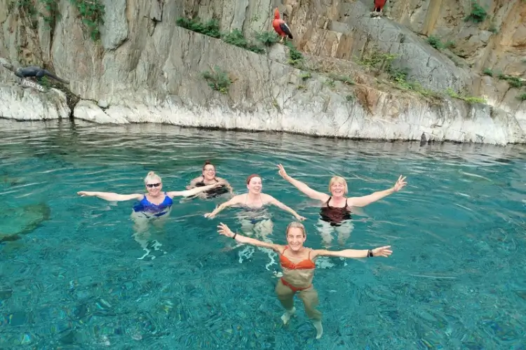 Travelers relaxing at Cocalmayo Hot Springs during the Inka Jungle Trek