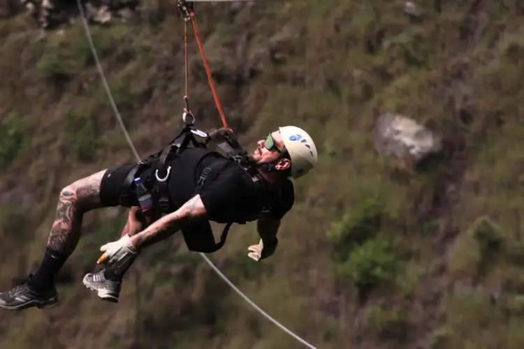 Travelers enjoying a zipline during the Inka Jungle Trek to Machu Picchu