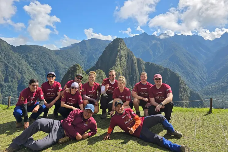 Panoramic view of Machu Picchu surrounded by green mountains at the end of the Salkantay Trek 7 Days